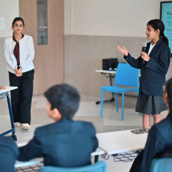 students-participating-in-a-classroom-debate-with-teacher-present (1)